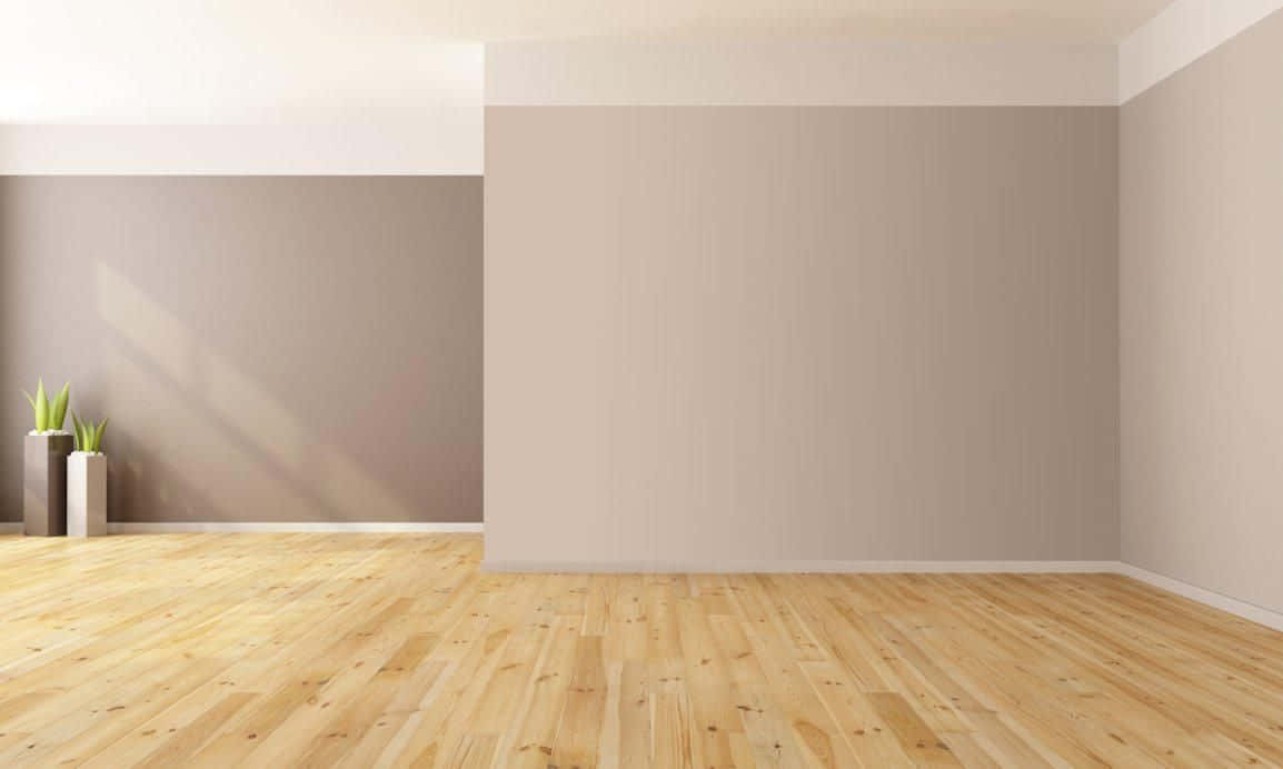 A Room With Wood Floors And Beige Walls