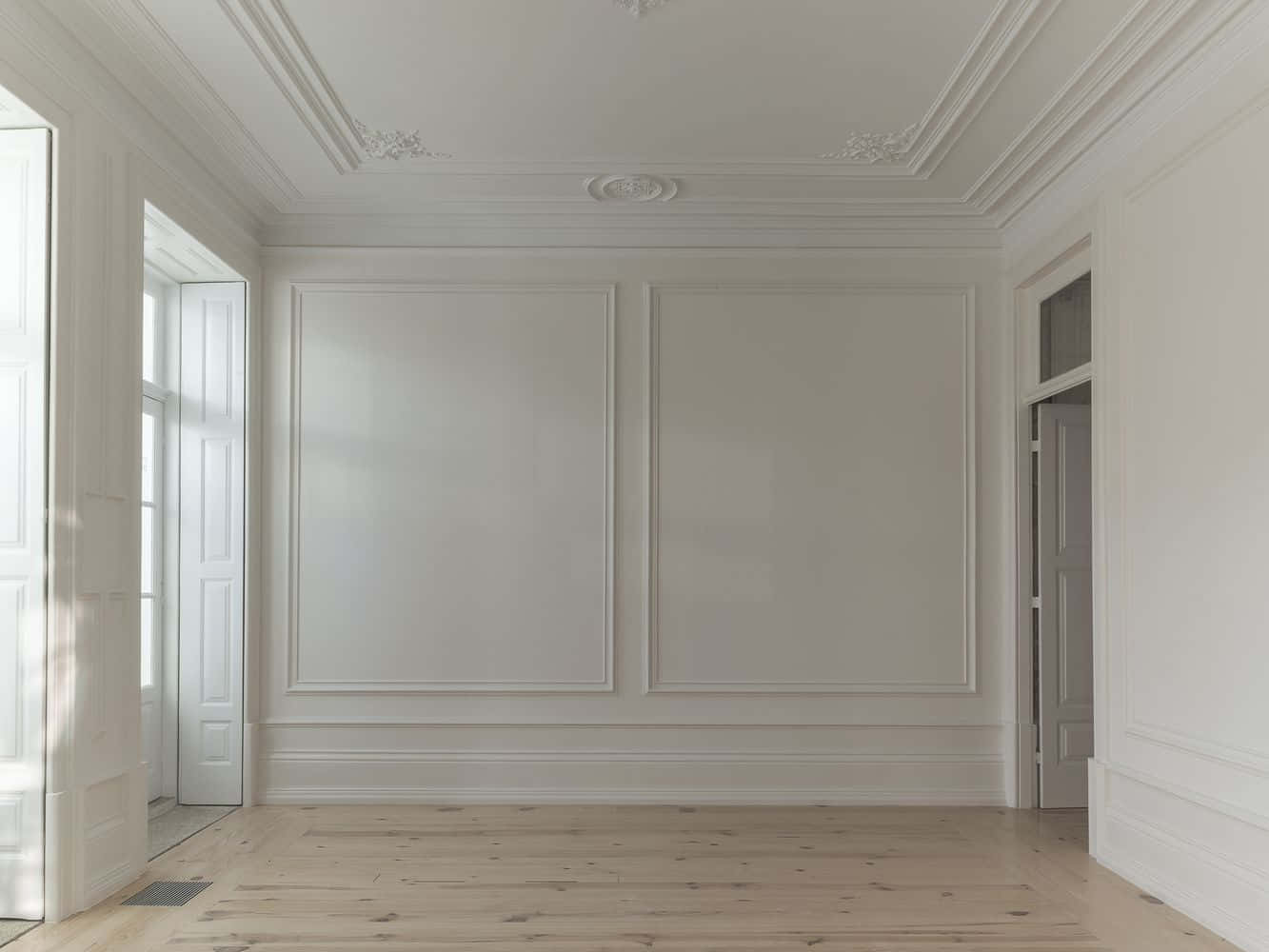 Empty Room With White Walls And Wooden Floor