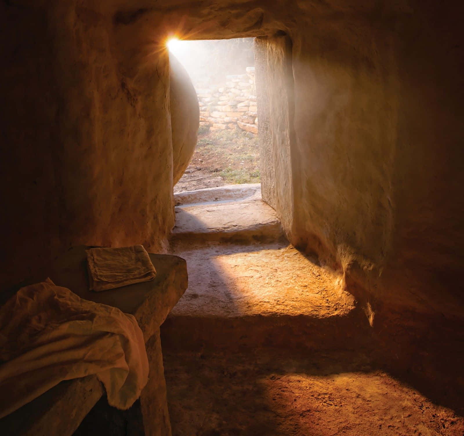 A Light Shines Through A Doorway Into A Cave Wallpaper