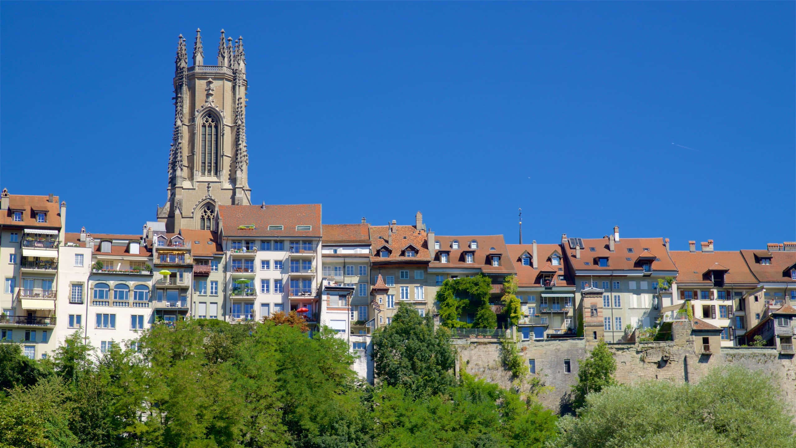 Enchanting Panoramic View Of Fribourg City, Switzerland Wallpaper