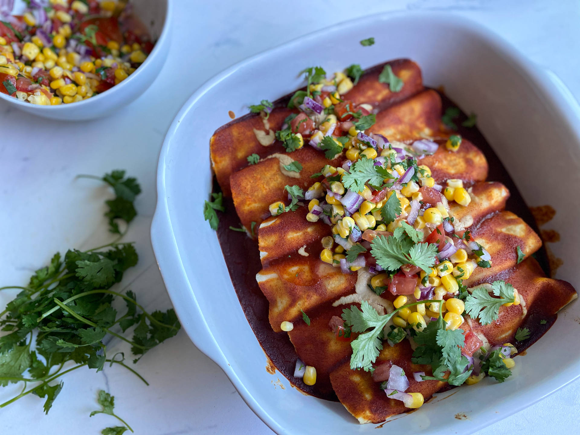 Delectable Enchiladas Topped with Fresh Vegetables Wallpaper