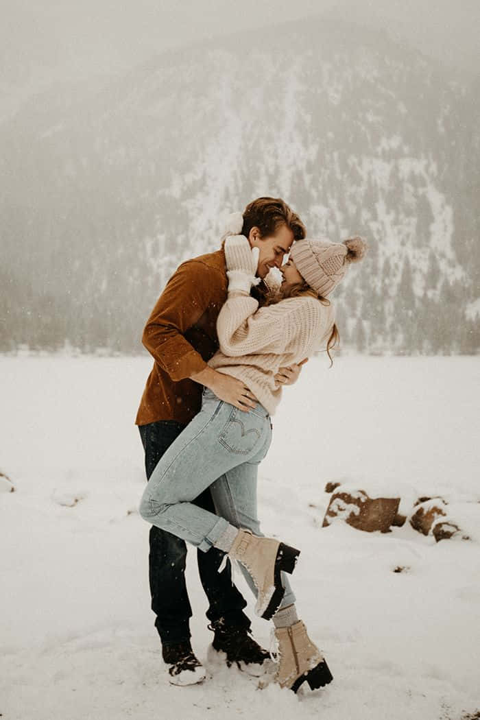Engagement Couple Kissing On Snow Pictures