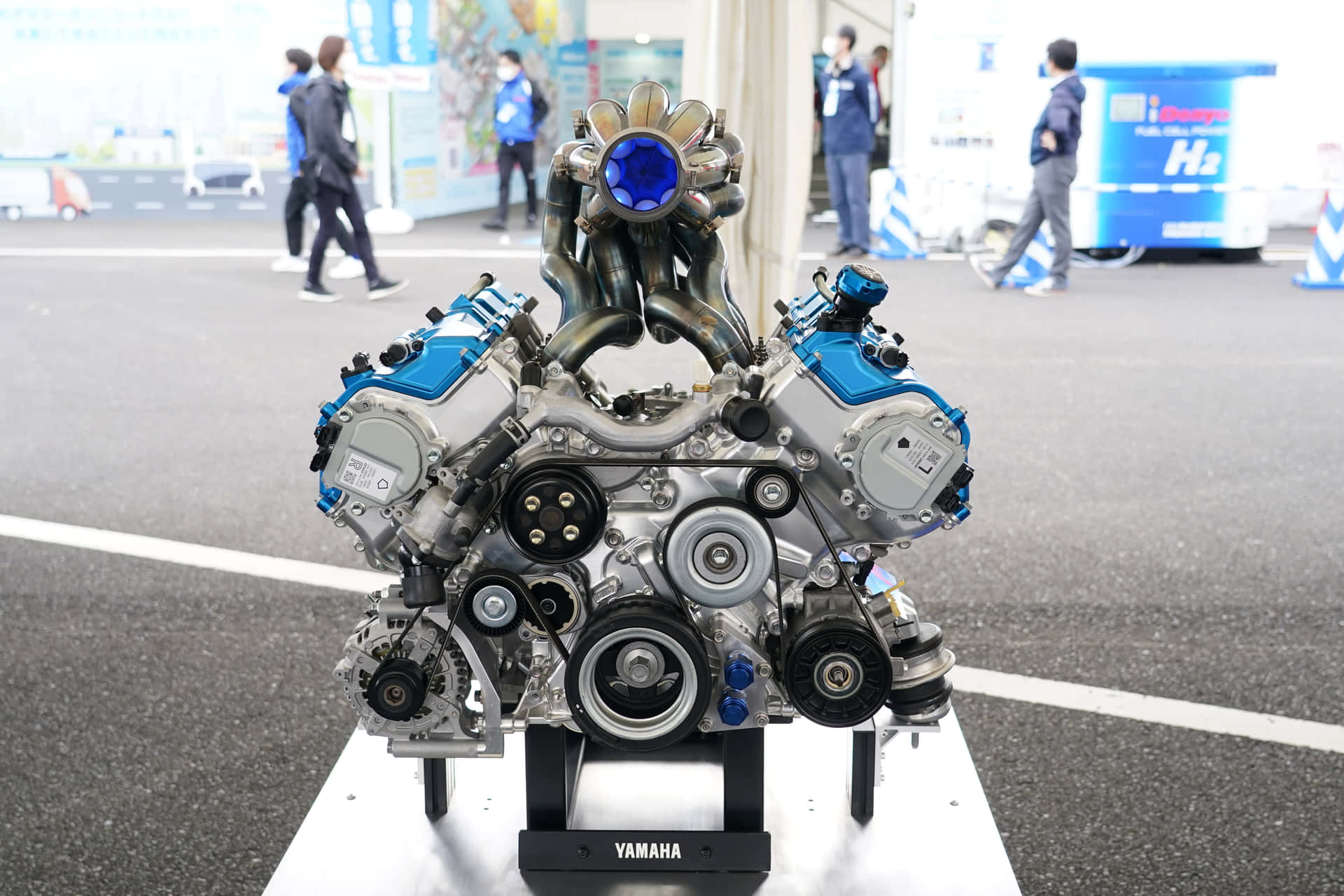 A Blue Engine On Display In A Room