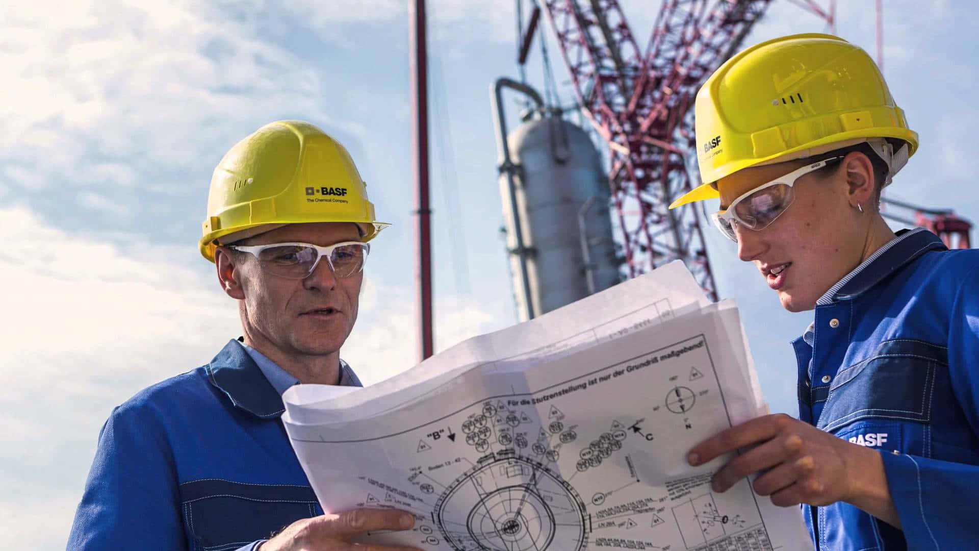 An engineer looking over blueprints for a project