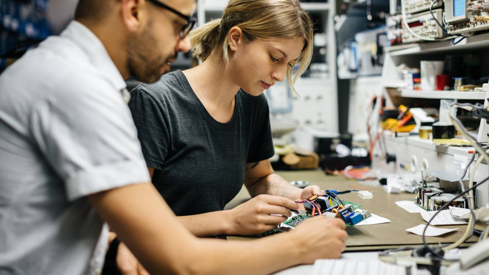 Engineers Fixing Electronic Components Background