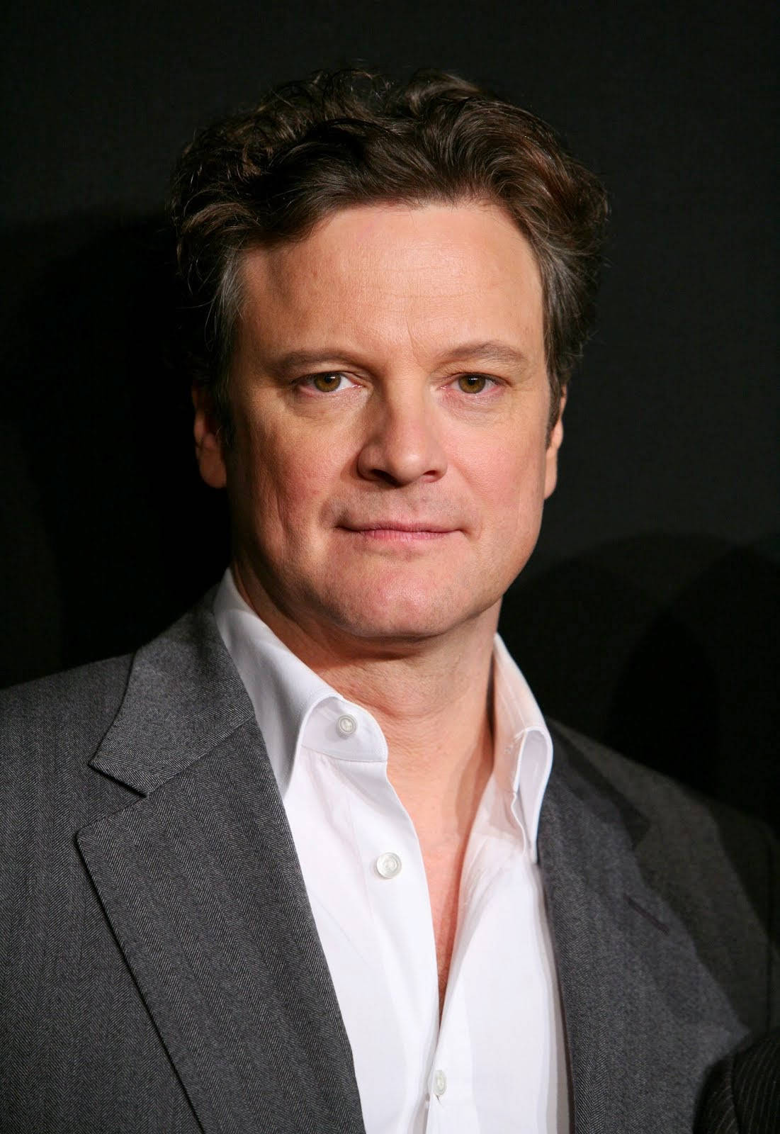 Charismatic Gaze: Close-up Portrait of English Actor Colin Firth Wallpaper