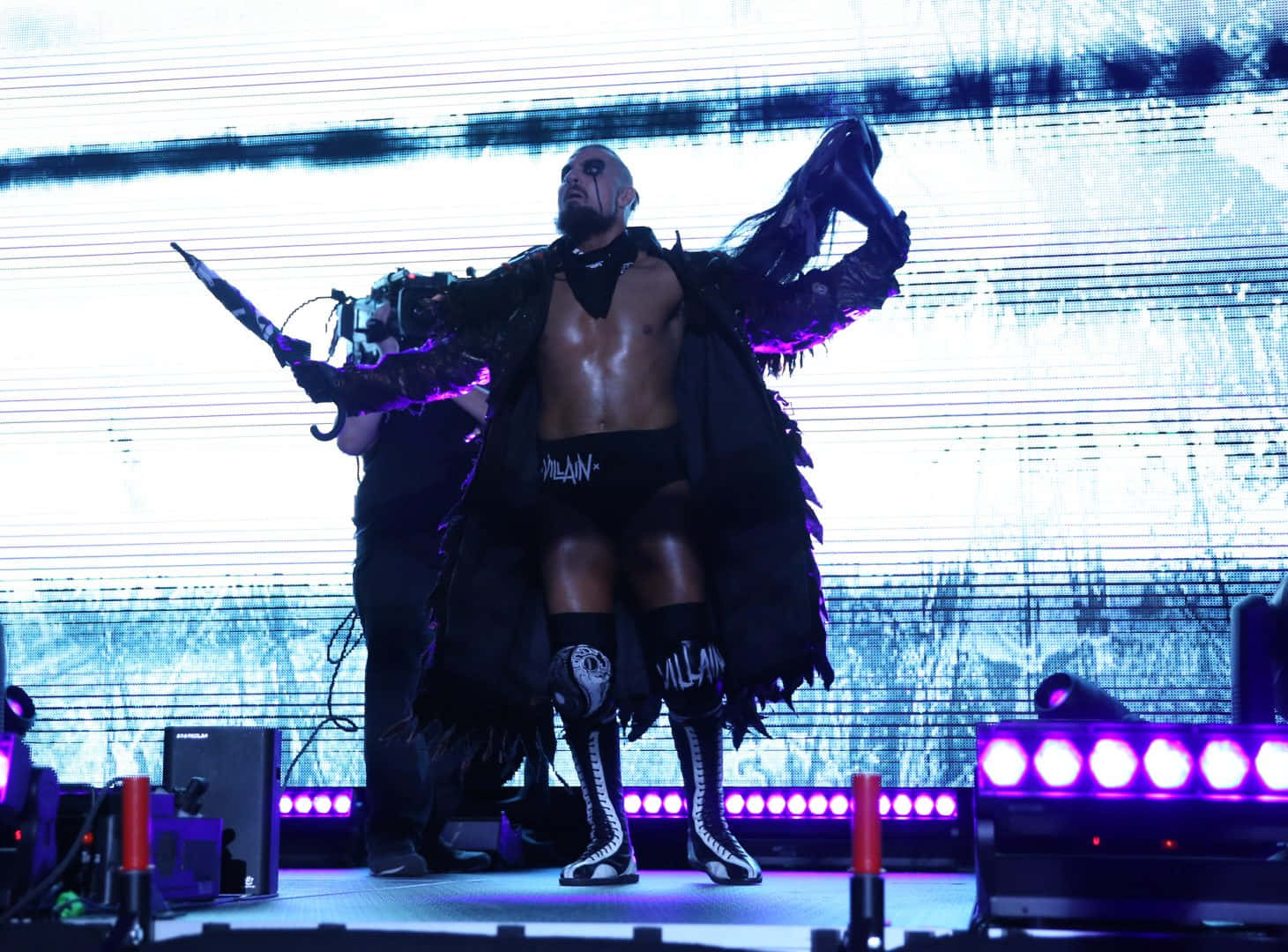 Caption: "Marty Scurll, Renowned English ROH Wrestler, Making His Grand Entrance On Stage" Wallpaper