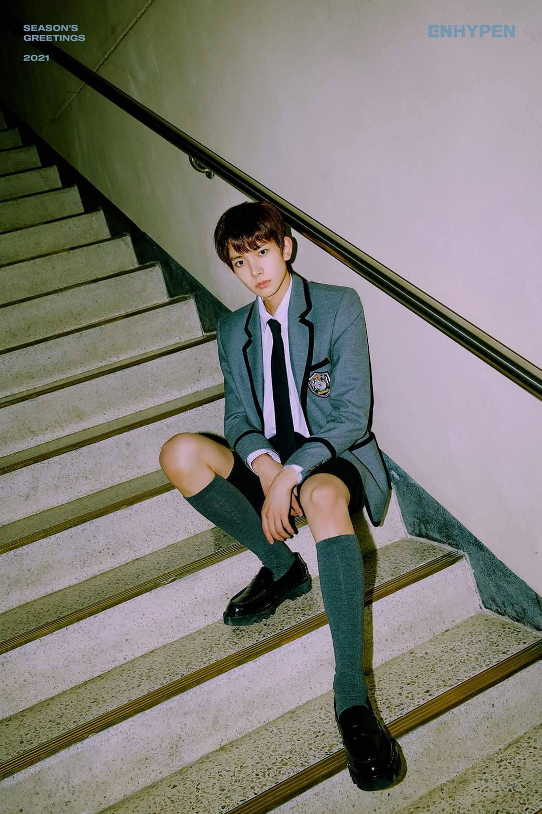 Enhypen Member Heeseung On The Stairs Background
