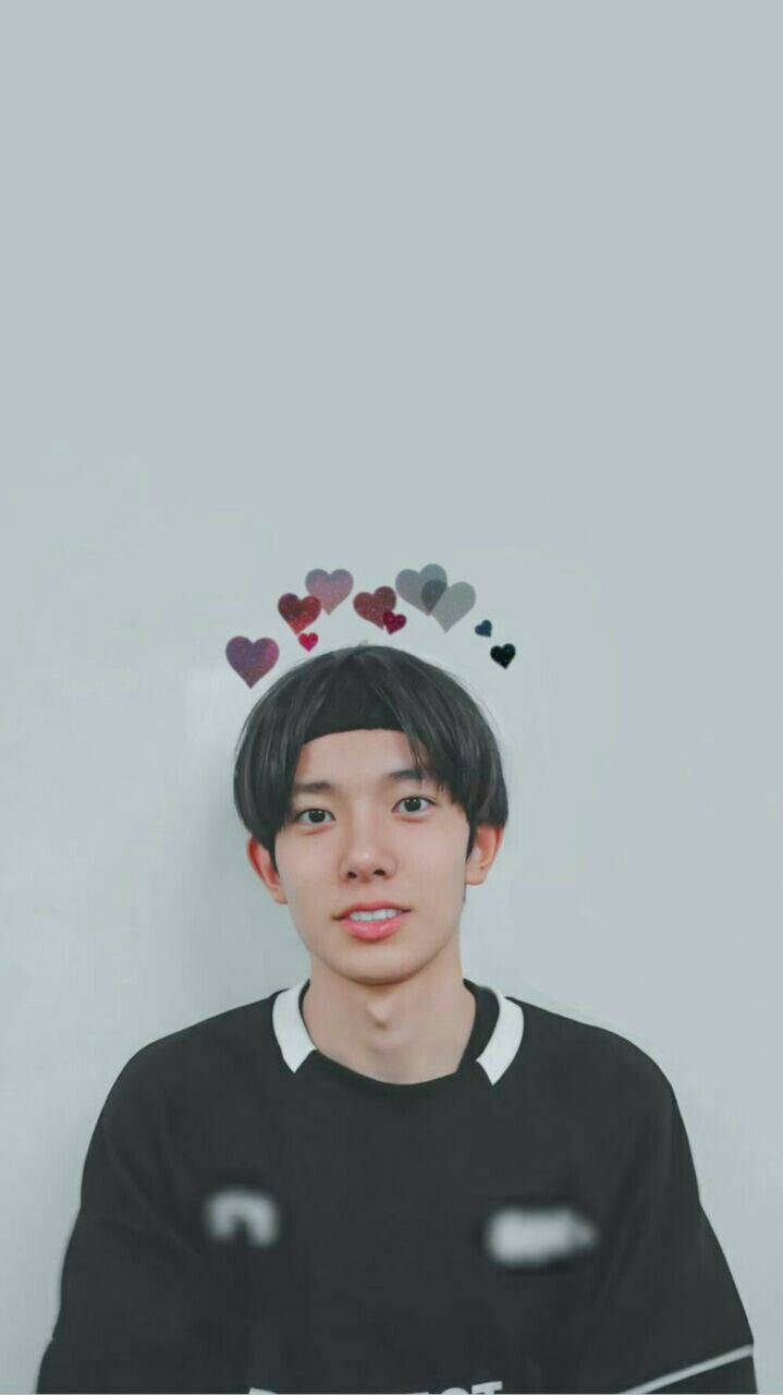 Enhypen Member Heeseung With Hearts Background