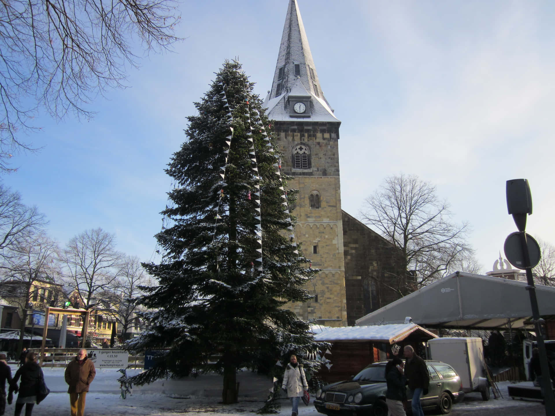 Enschede Winter Scenewith Churchand Christmas Tree Wallpaper