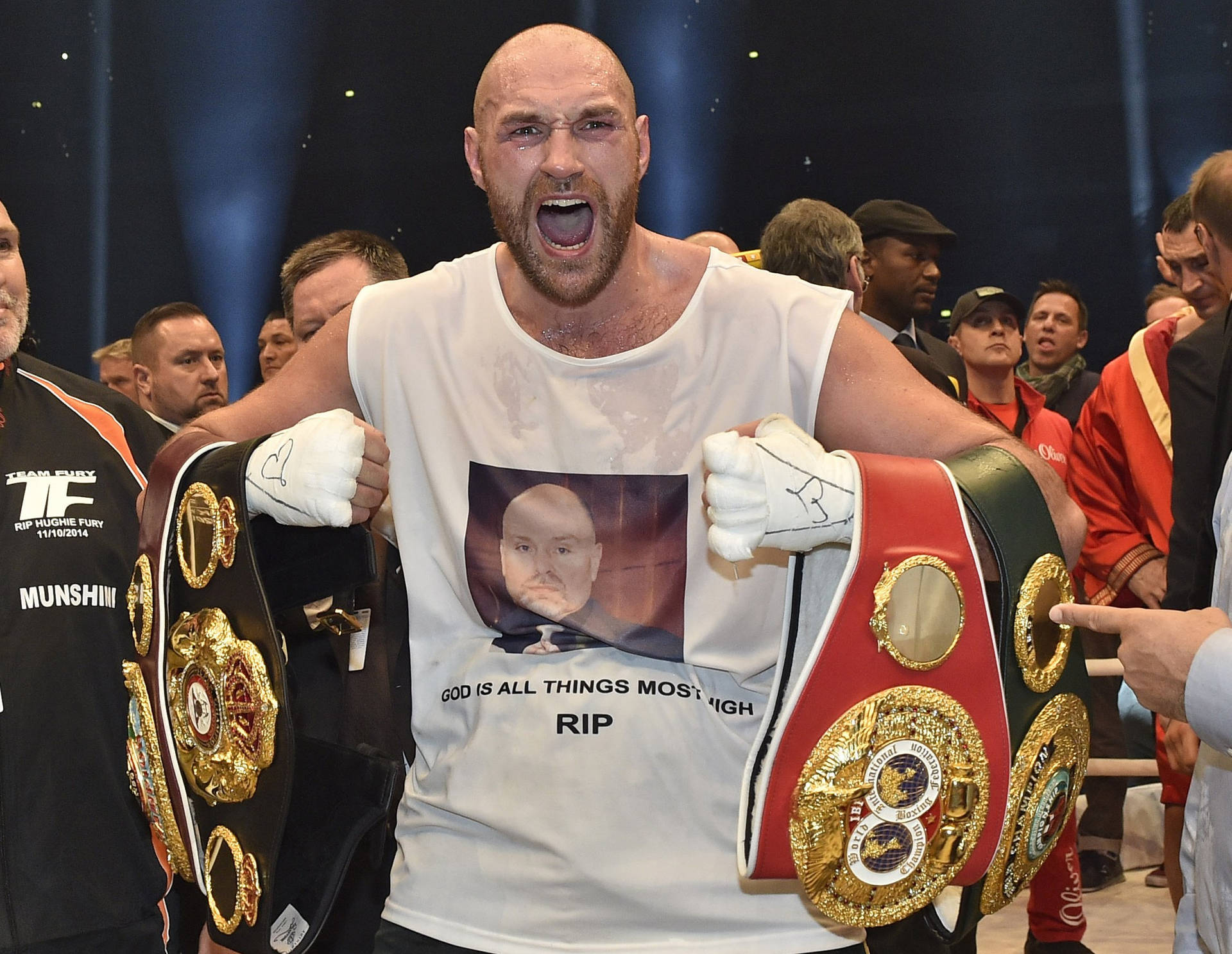 Enthusiastic Tyson Fury Carrying Title Belts Wallpaper