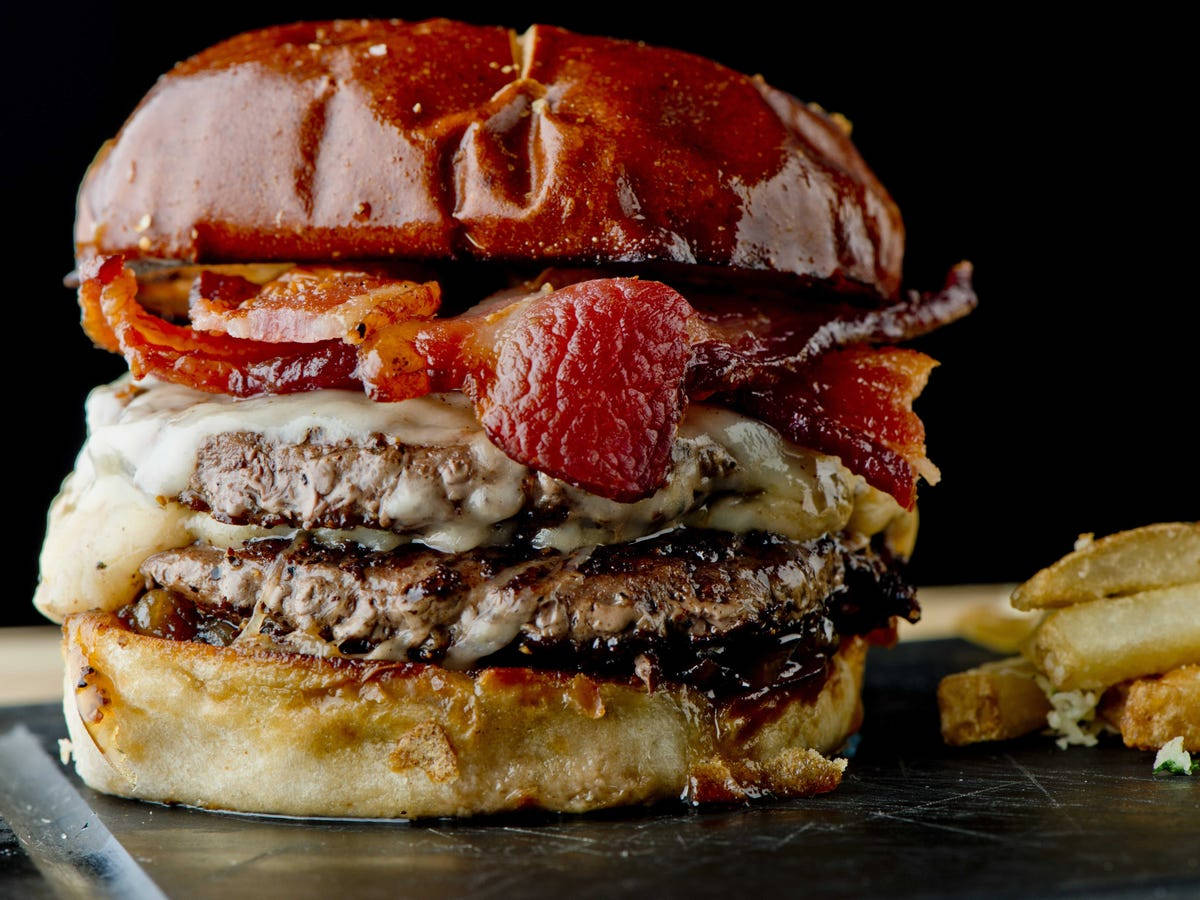 A mouth-watering burger topped with crispy sheesh bacon. Wallpaper