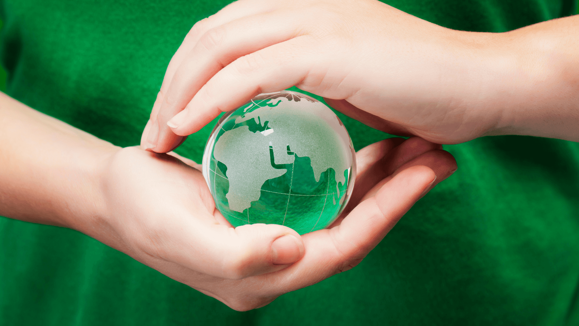 Nature Has Much to Offer Background — Two hands gently cradle a translucent green globe symbolizing global care and environmental stewardship.