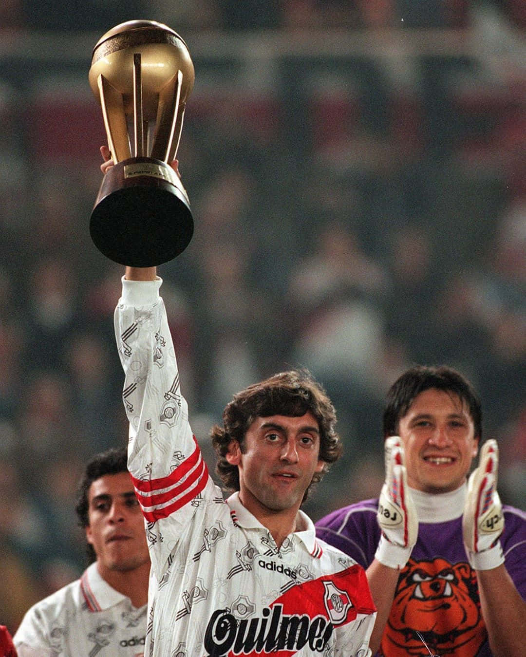 Enzo Francescoli holding the trophy of victory Wallpaper