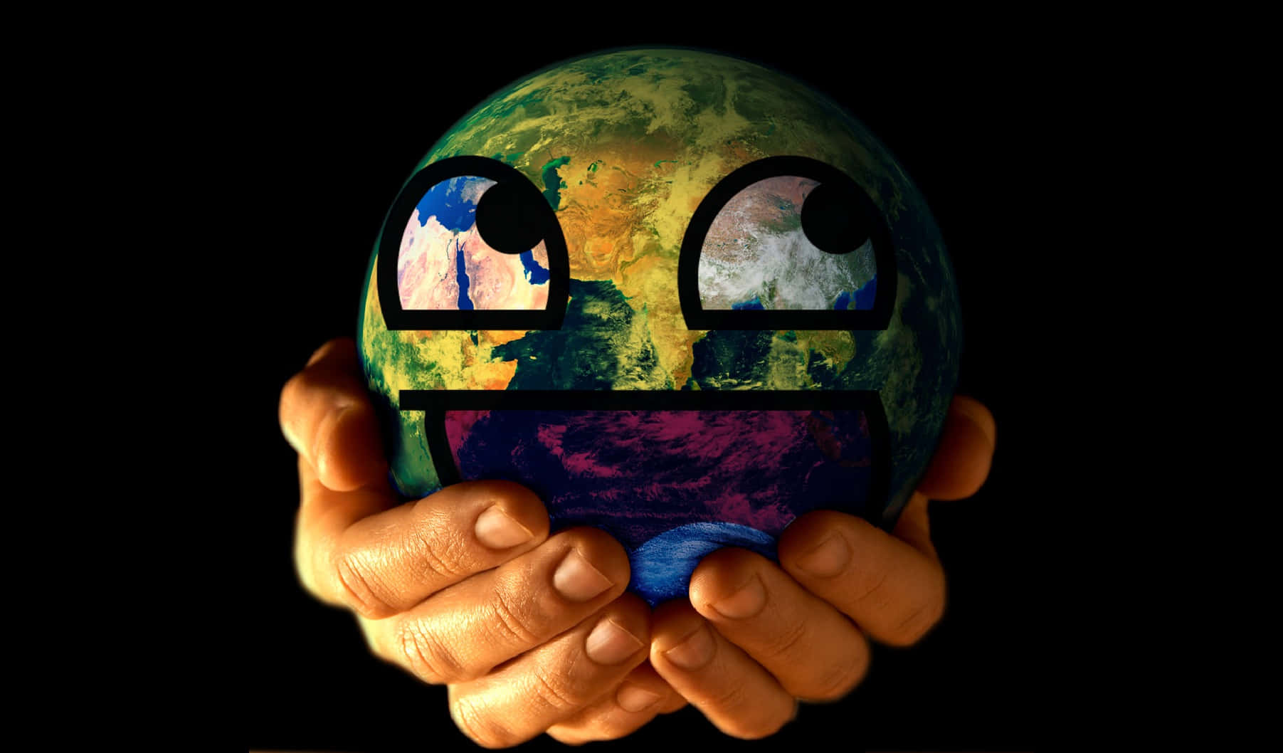 A Person Holding A Green Earth With A Face On It Wallpaper