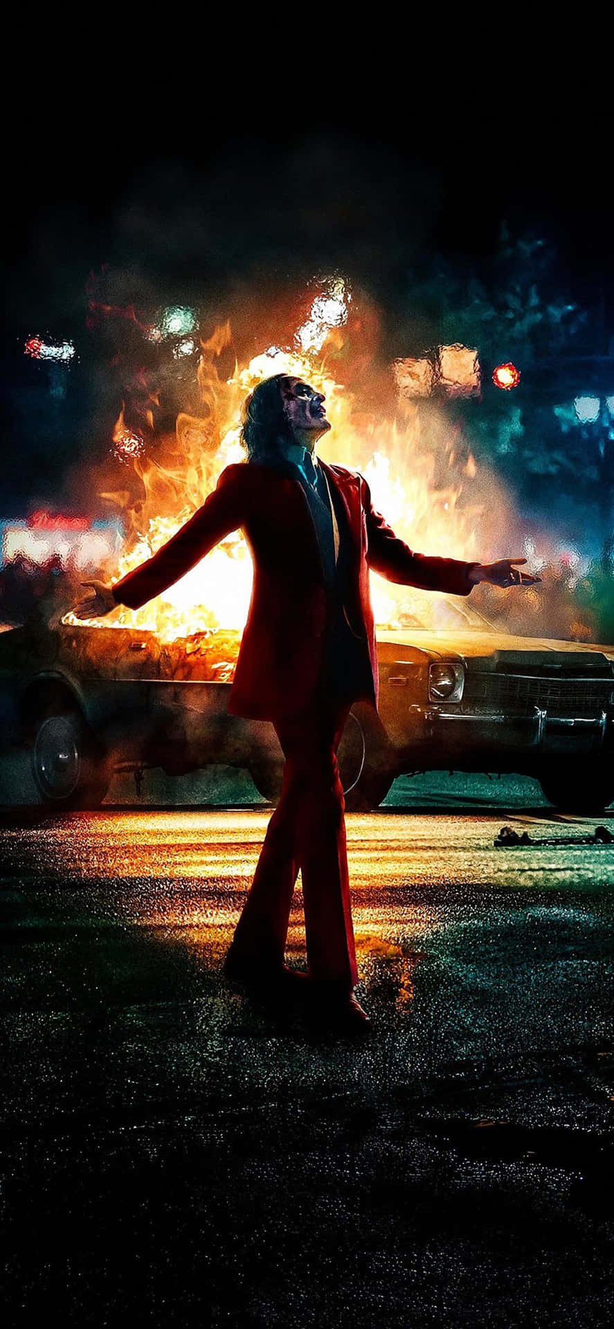Et Joker filmplakat med en mand i rød stående foran en bil Wallpaper