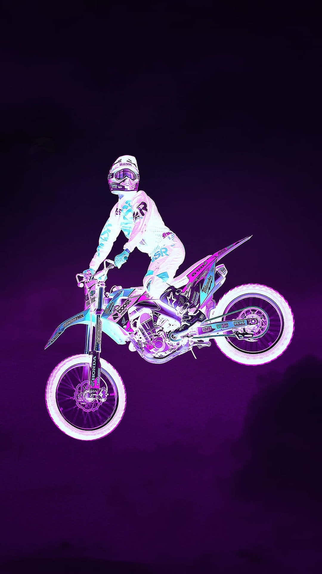 Unapersona Montando Una Motocicleta De Tierra En El Aire Fondo de pantalla