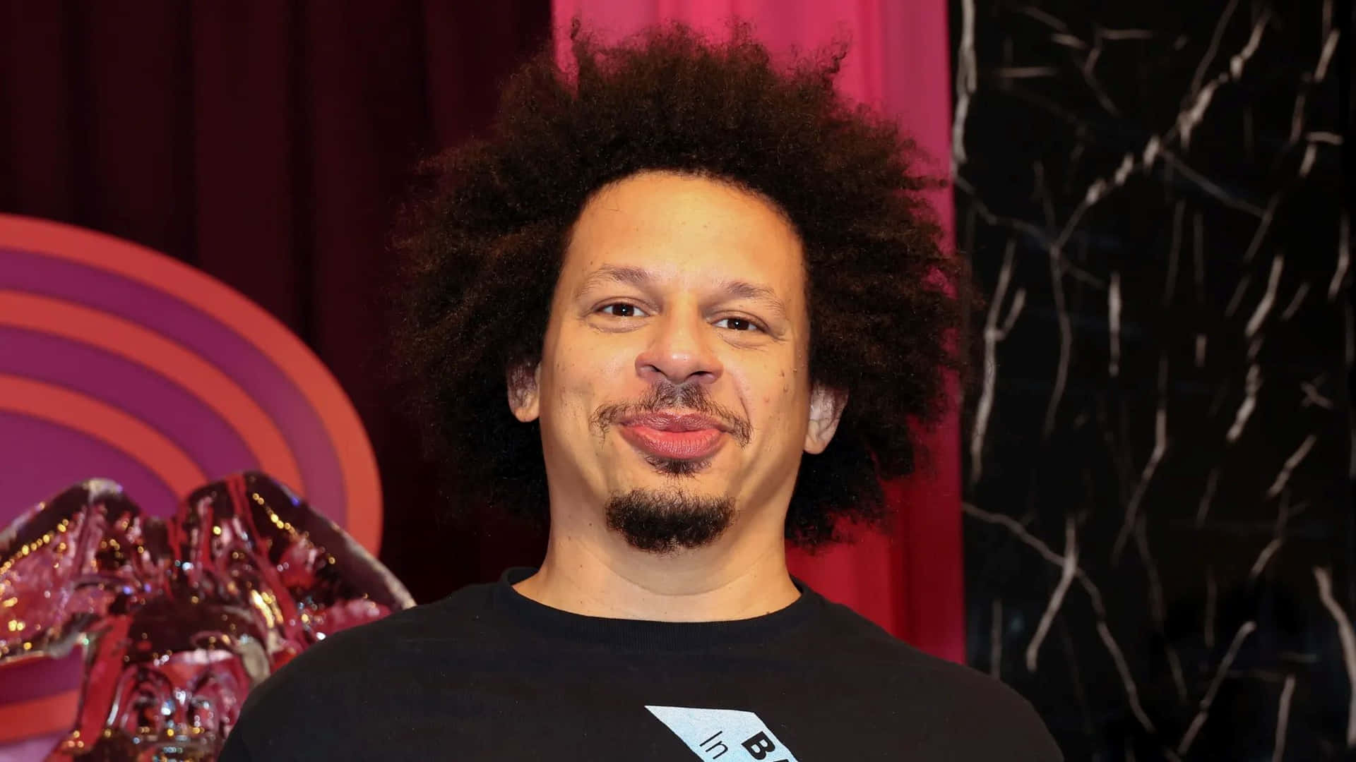 Download Eric Andre Comedic Pose Wallpaper | Wallpapers.com