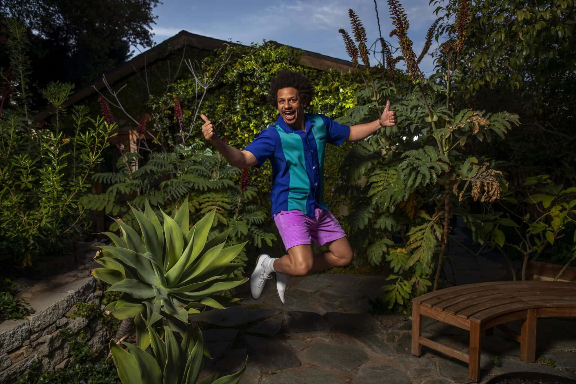 Eric Andre Jumping Garden Thumbs Up Wallpaper