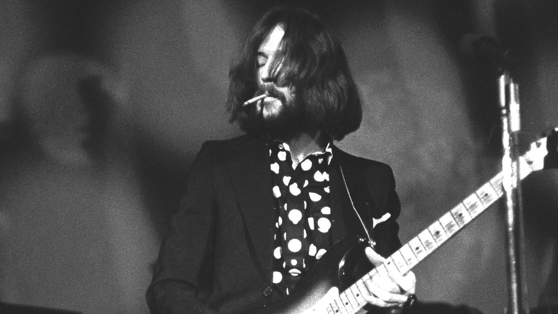 Eric Clapton Guitar While Smoking Wallpaper
