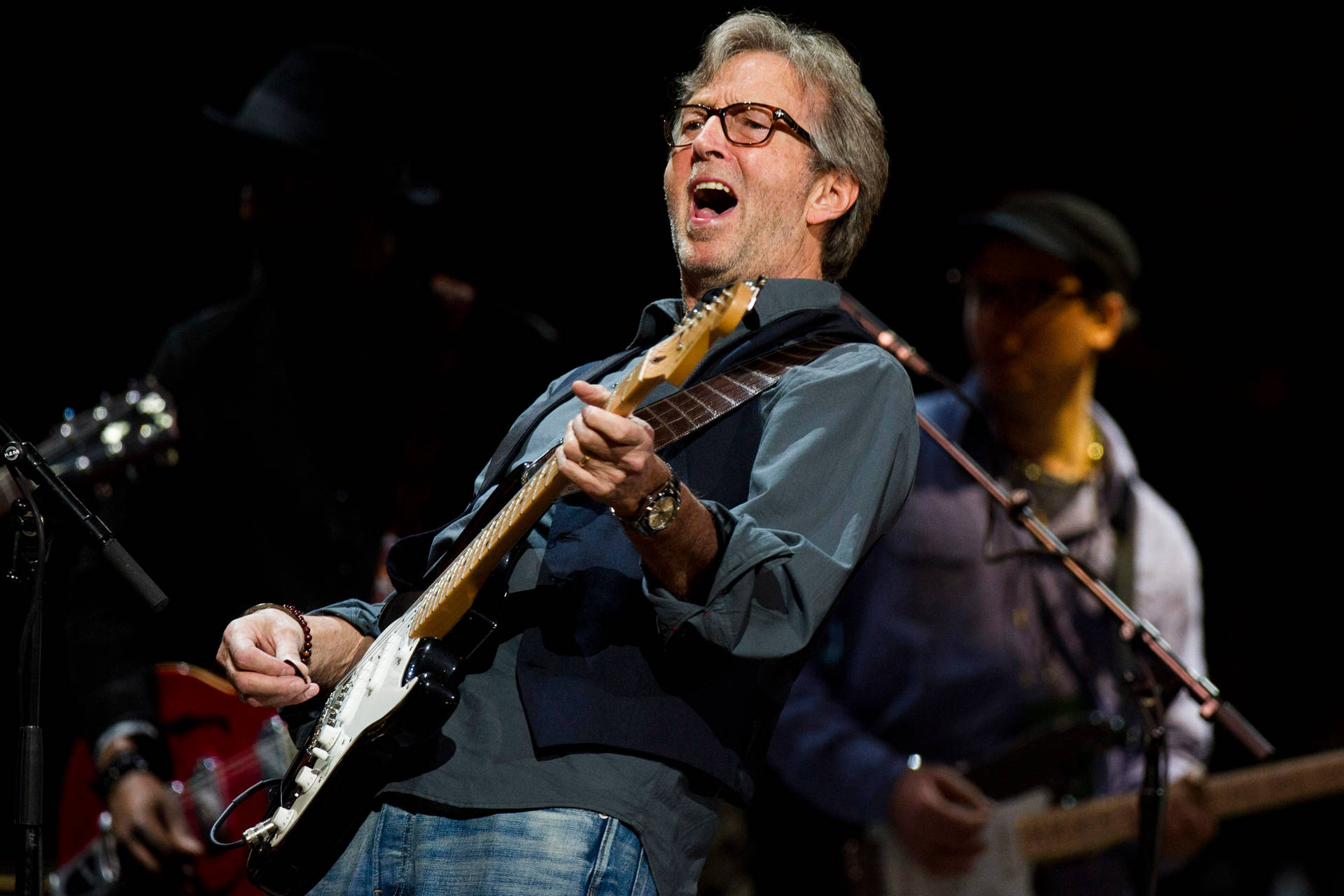 Eric Clapton Happily Playing Guitar Wallpaper