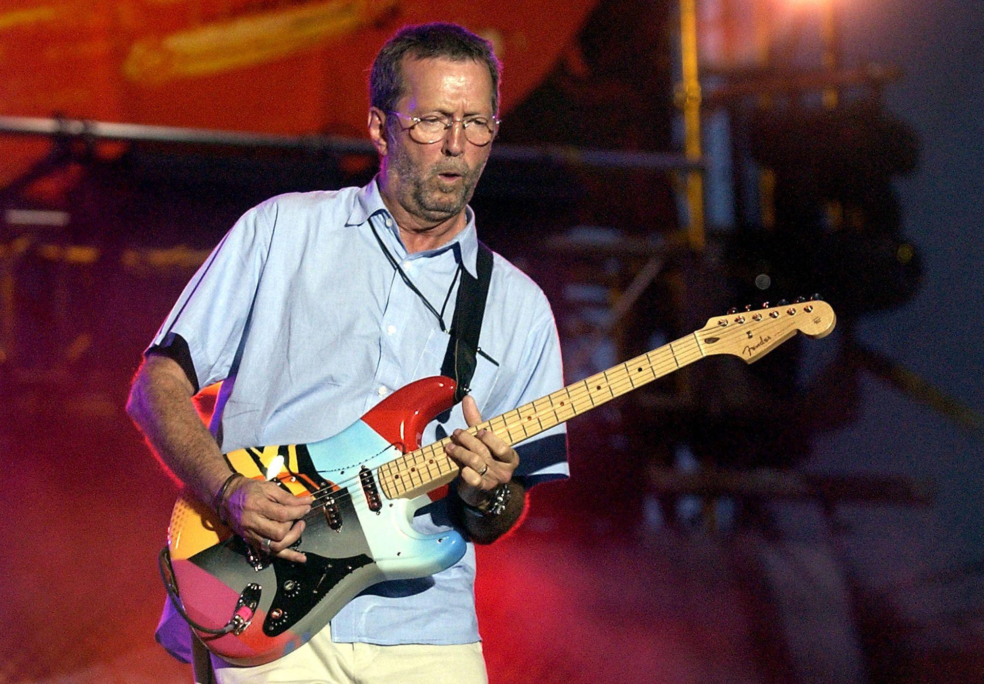 Eric Clapton Rocking Colorful Guitar Wallpaper