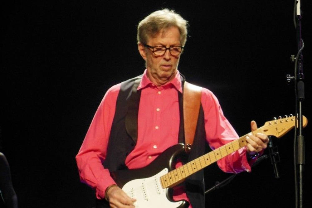 Eric Clapton Wearing Signature Black Vest Wallpaper