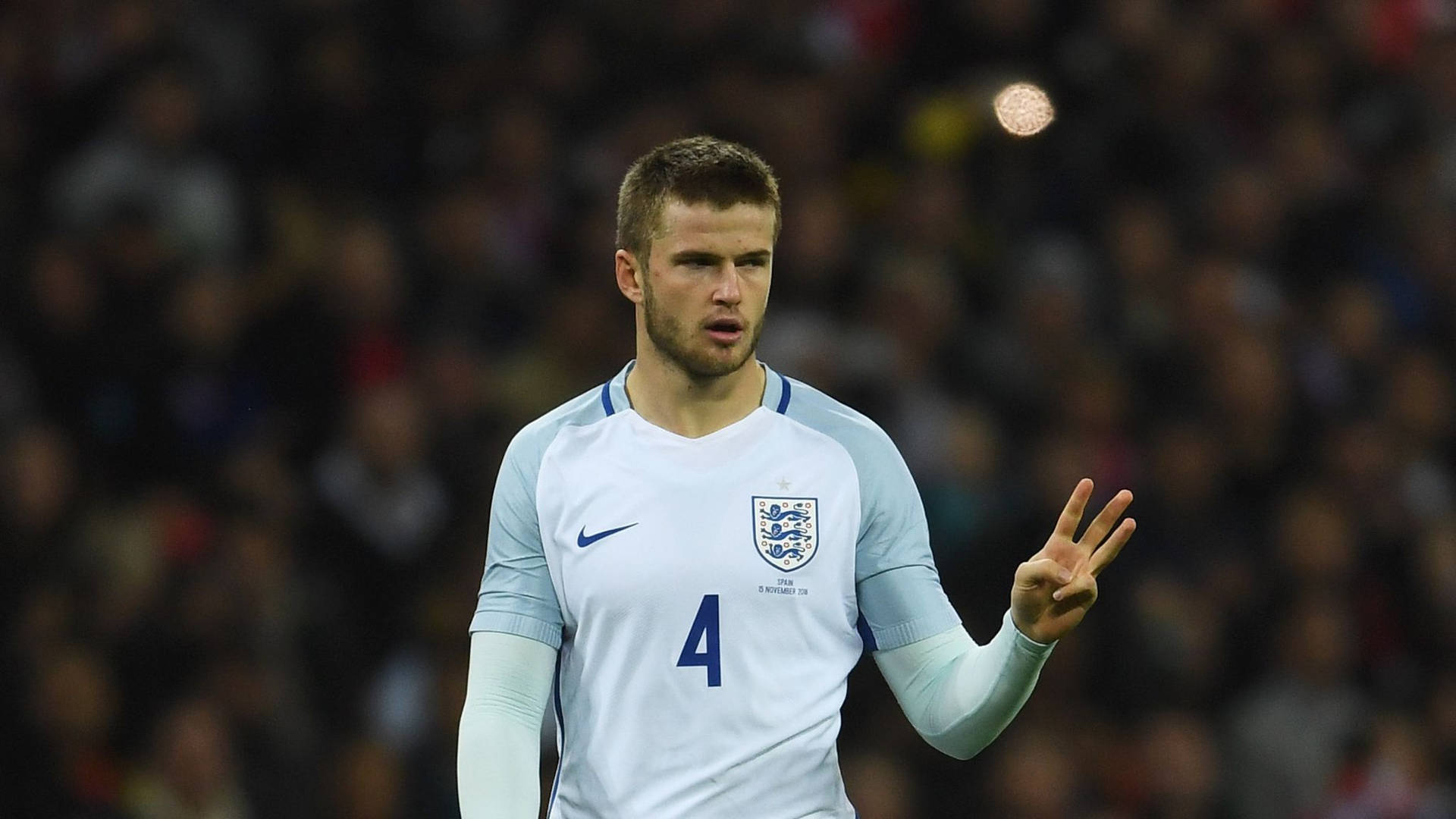 Eric Dier Holding Up Three Fingers Wallpaper
