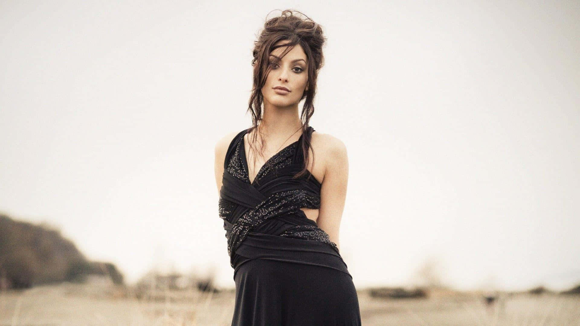 Erica Cerra Elegant Black Dress Outdoors Wallpaper