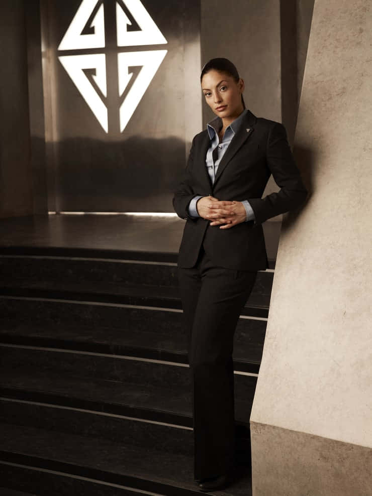 Erica Cerra Elegant Suit Pose Wallpaper