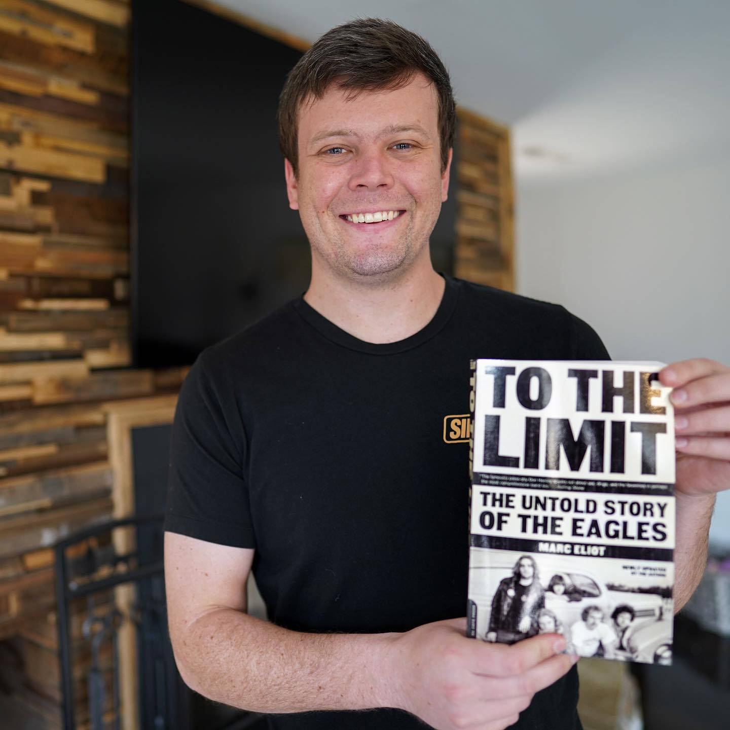 Erik Jones Holding "to The Limit" Book Wallpaper