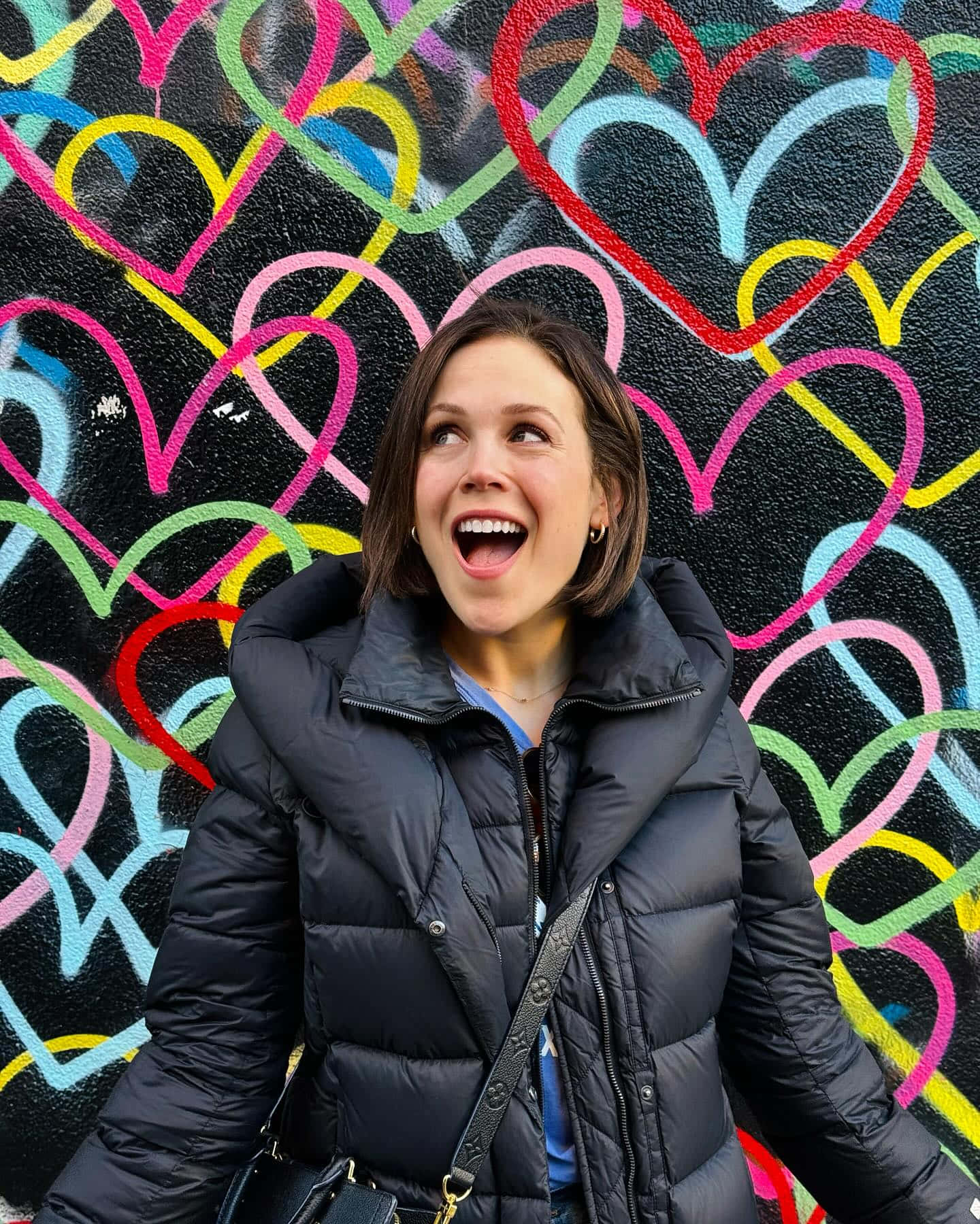 Erin Krakow Happy Moment Against Heart Graffiti Wall Wallpaper