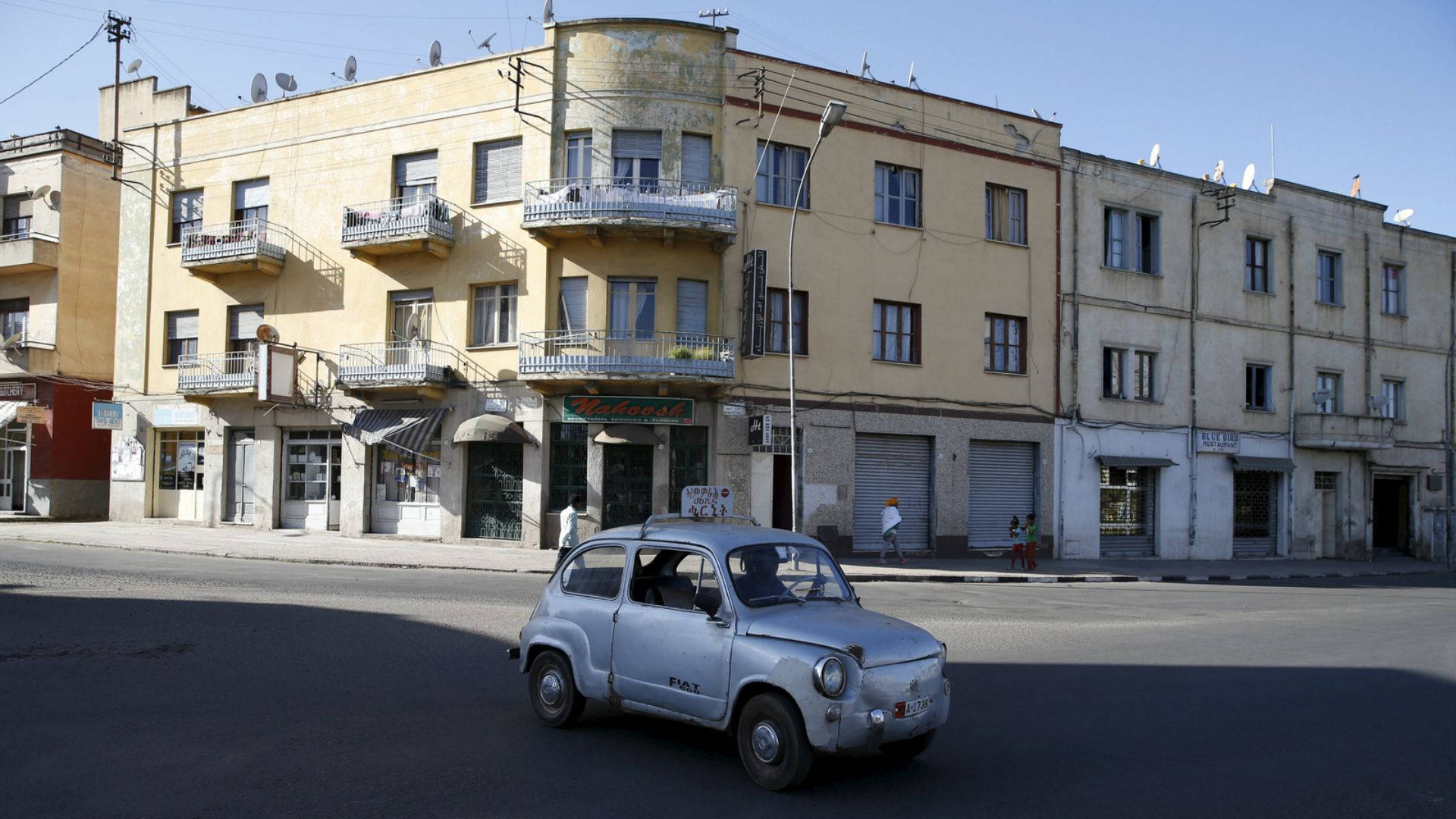 Eritrea Car In Front Of Building Background