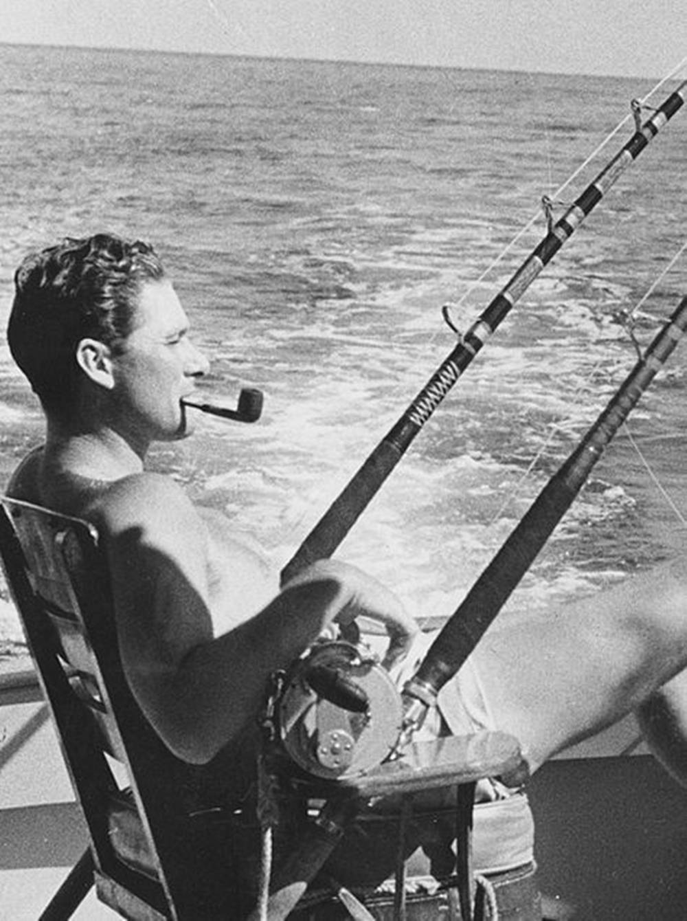 Errol Flynn Smoking Pipe By Water Wallpaper