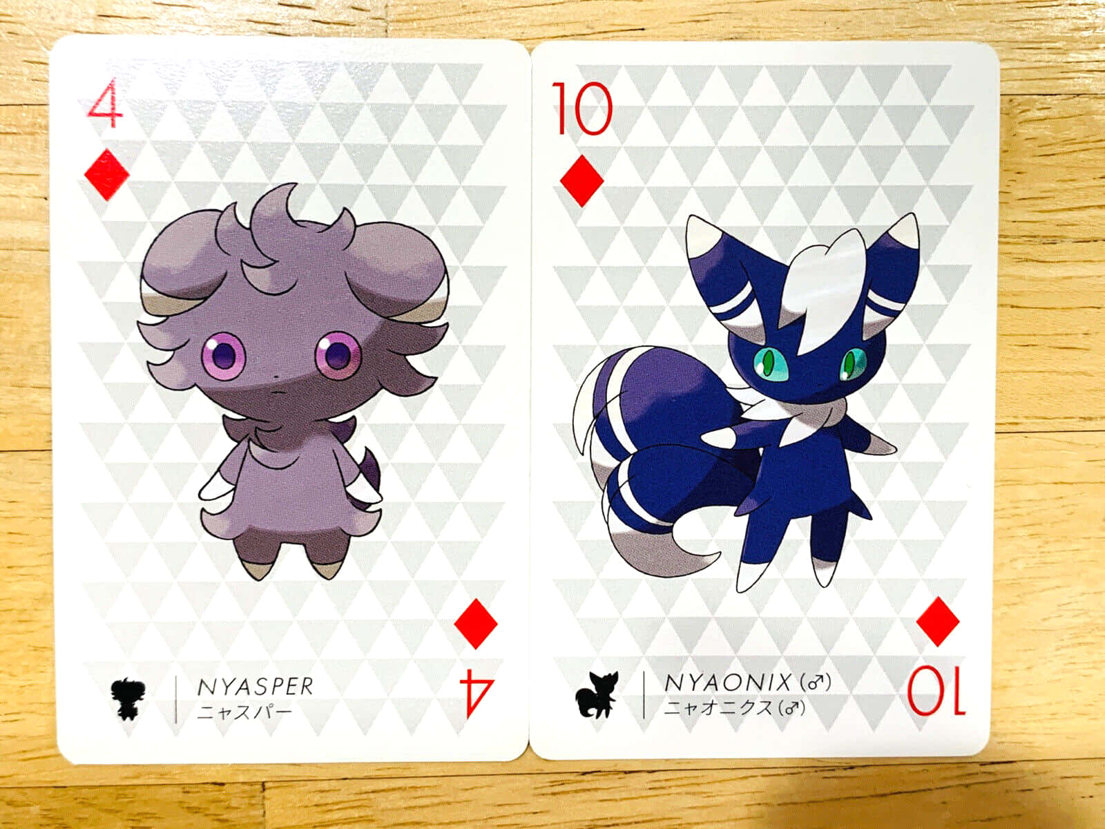 Espurr And Meowstic Pokémon Playing Cards Wallpaper