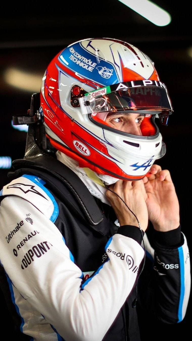 Esteban Ocon, focused and ready with his racing helmet. Wallpaper