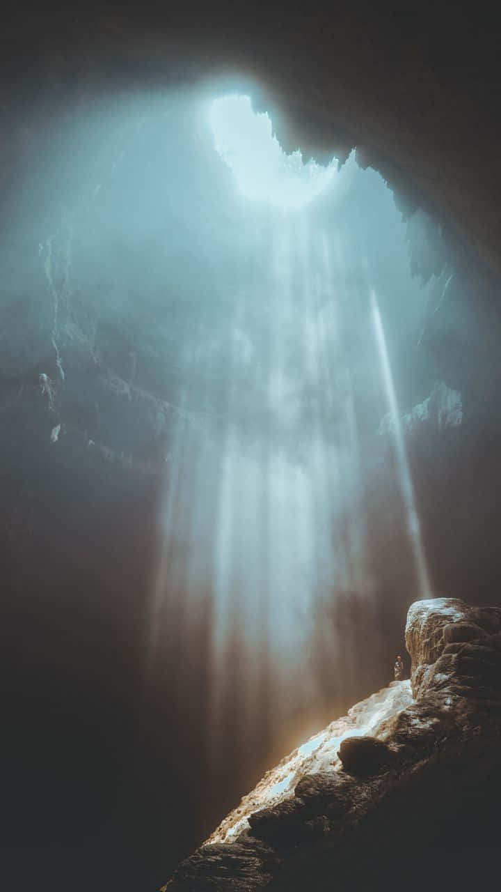 Ethereal Cave Light Rays.jpg Wallpaper