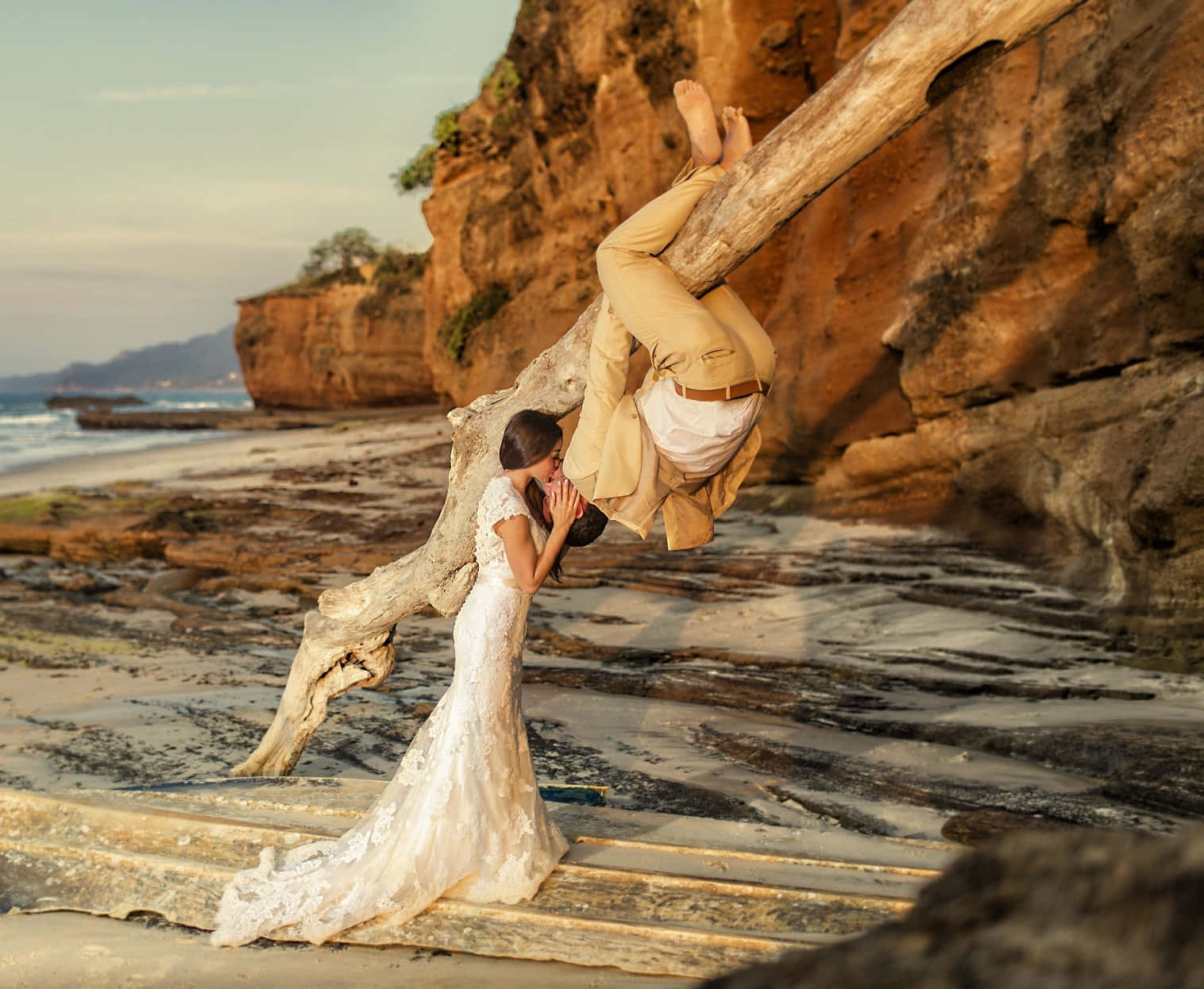 "ethereal Love - Bride And Groom Embrace On The Beach At Sunset" Wallpaper