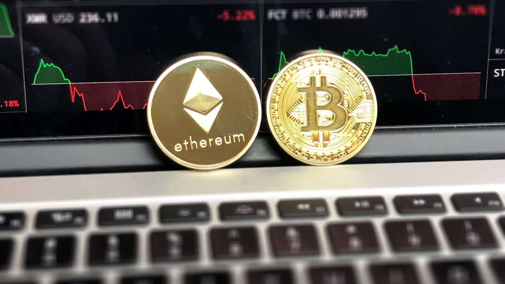 Ethereum And Bitcoin On Laptop Wallpaper