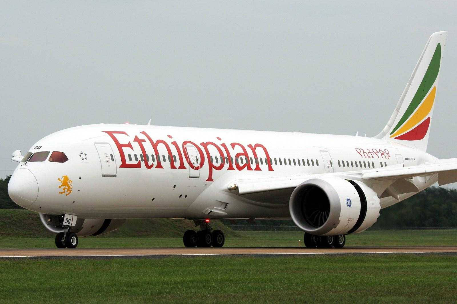 Ethiopian Airlines Plane On Grassy Runway Wallpaper