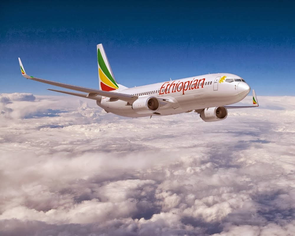 Ethiopian Airlines Plane Winging In Cloudy Sky Wallpaper