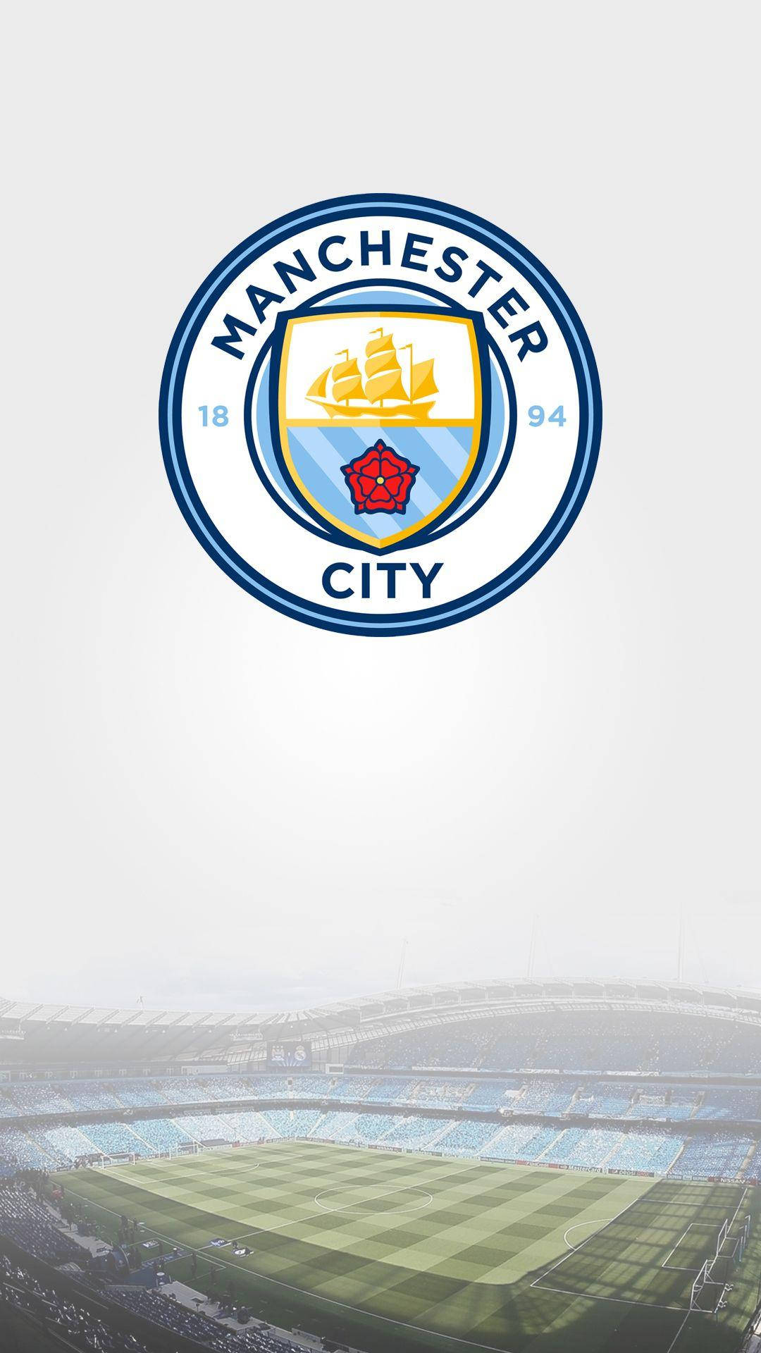 Etihad Stadium With The Manchester City Logo Background
