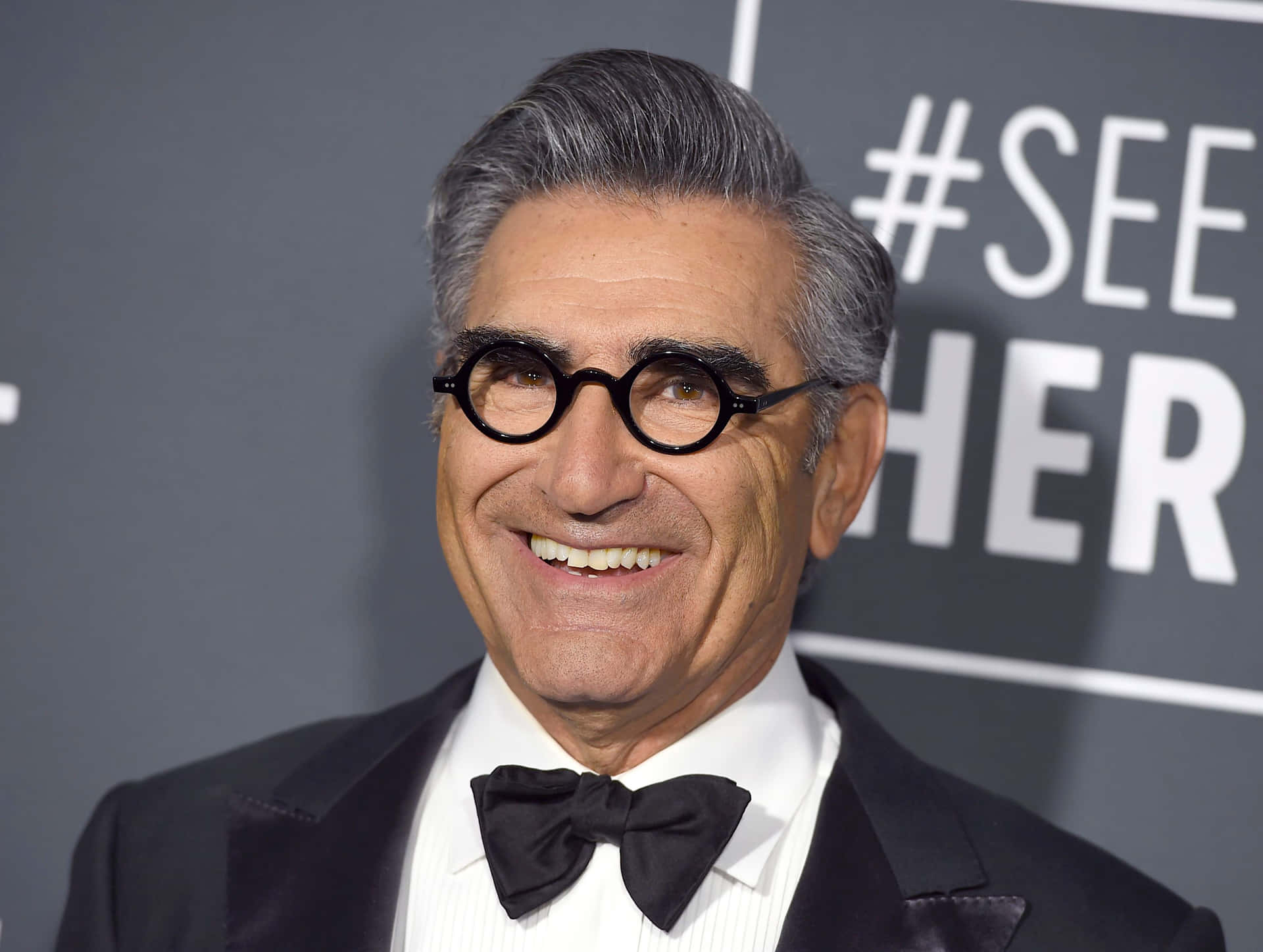 Renowned Actor Eugene Levy Smiling during an Entertainment Event Wallpaper