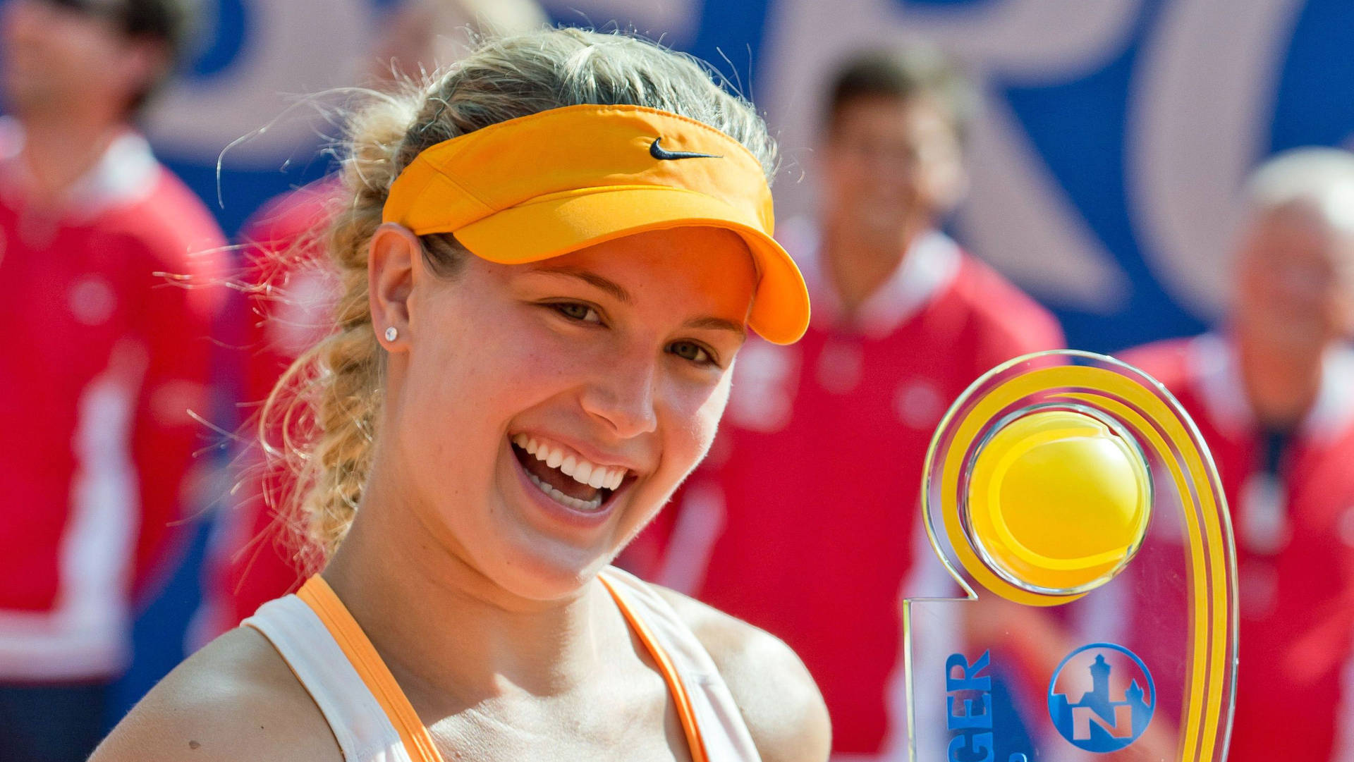 Eugenie Bouchard Smiling With Trophy Wallpaper