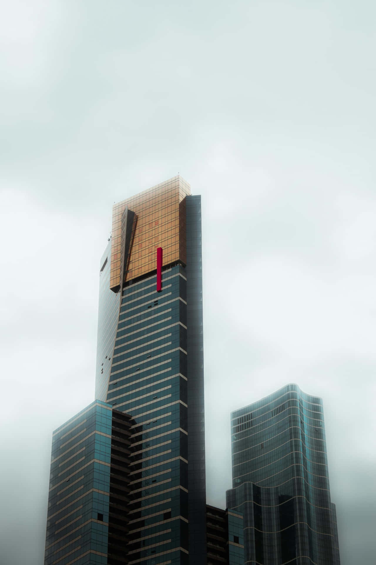 Eureka Tower Amidst Clouds Wallpaper