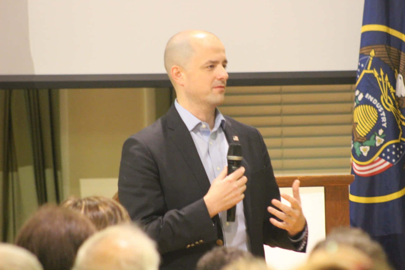 Evan Mcmullin Giving A Speech Wallpaper