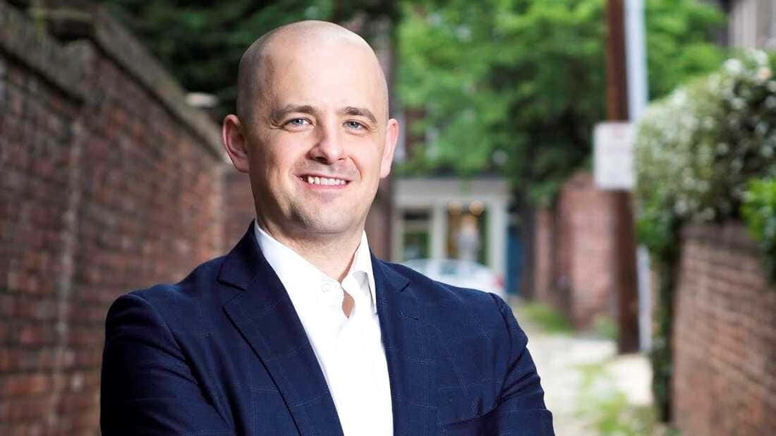 Evan Mcmullin In A Discussion Event Wallpaper