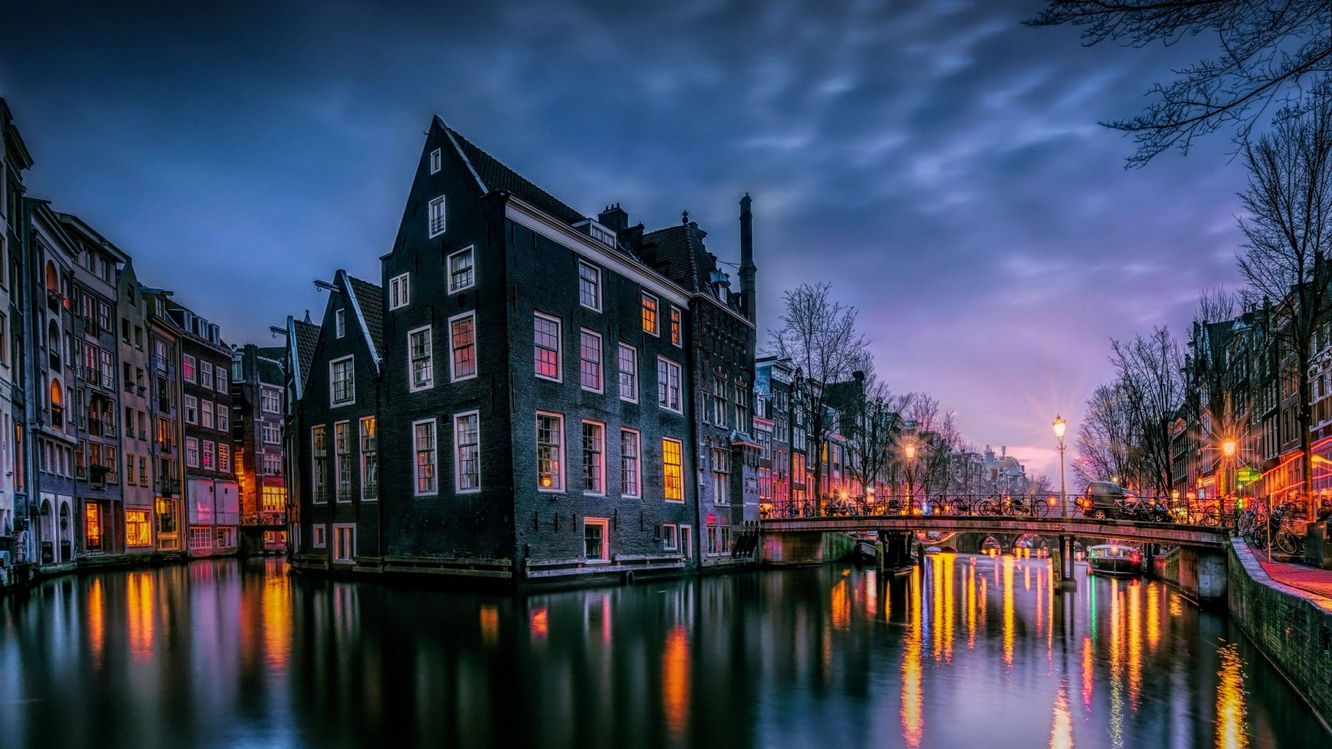 Evening Lights At Amsterdam Canal Background
