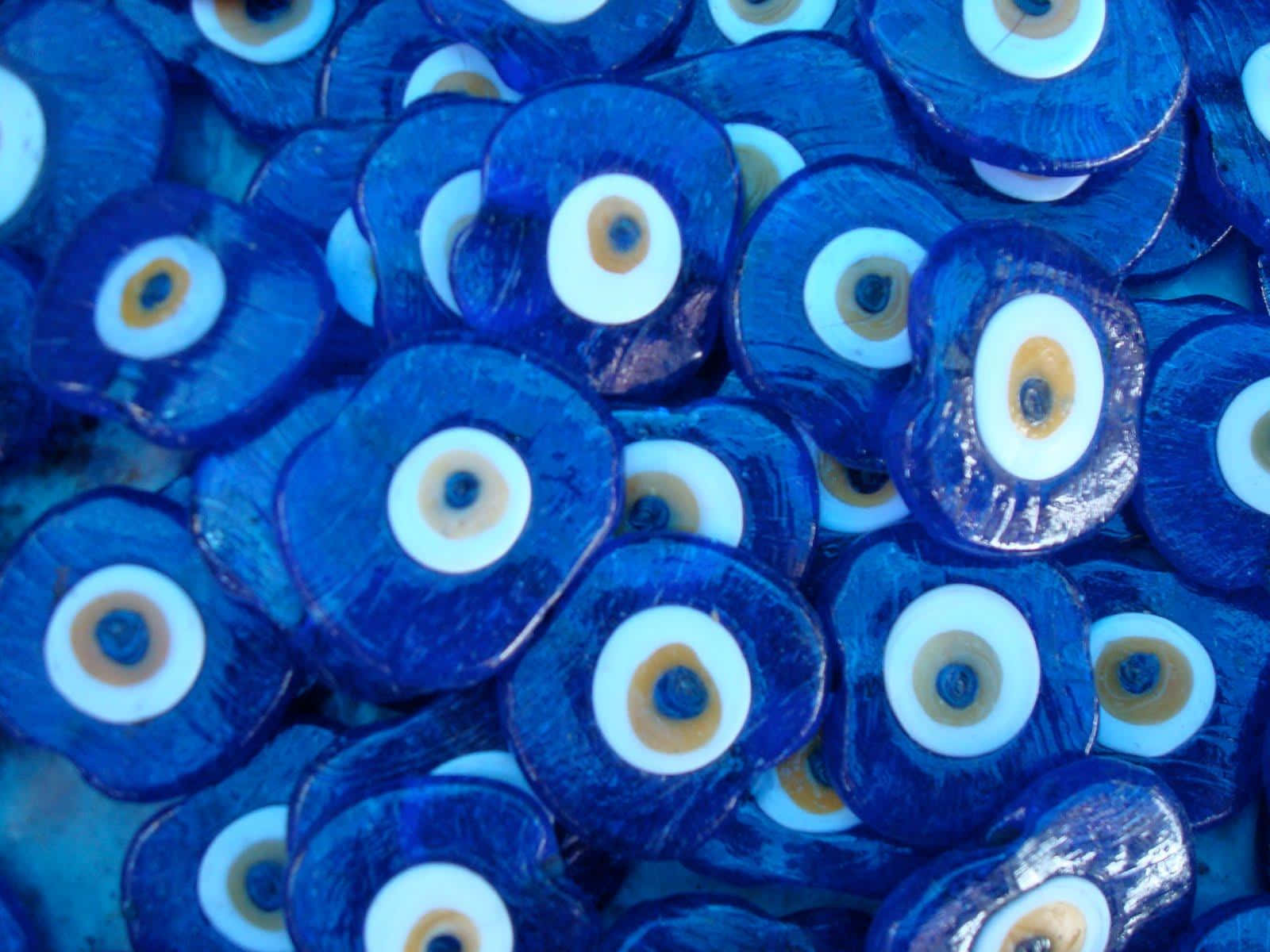 A Close Up Of Blue Evil Eye Beads