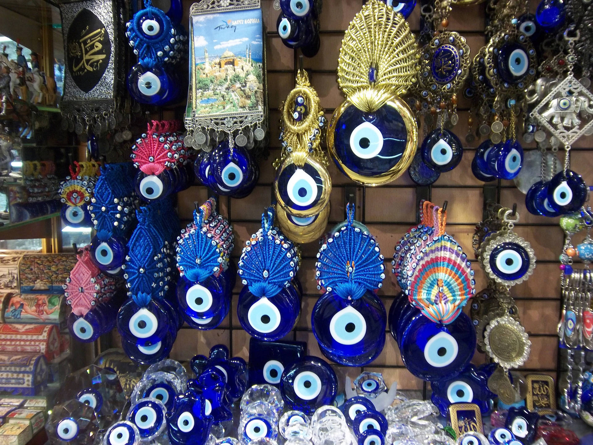 Vibrant Array of Evil Eye Charms Hanging Against A Light Background Wallpaper
